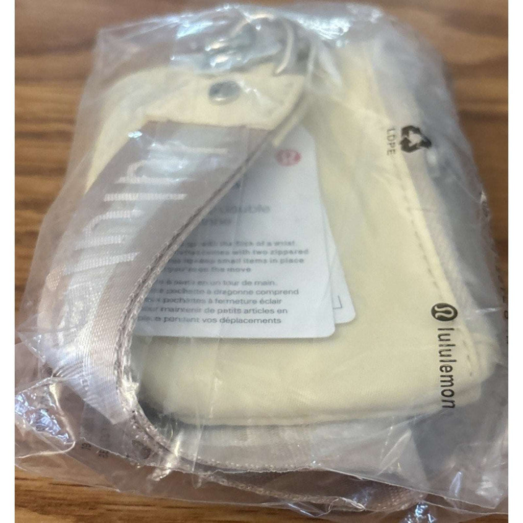 NWT Lululemon Dual Pouch Wristlet Wallet Keychain Wordmark Buttercream and Beige