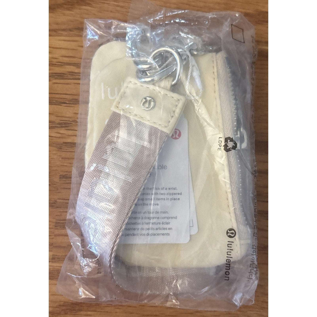 NWT Lululemon Dual Pouch Wristlet Wallet Keychain Wordmark Buttercream and Beige