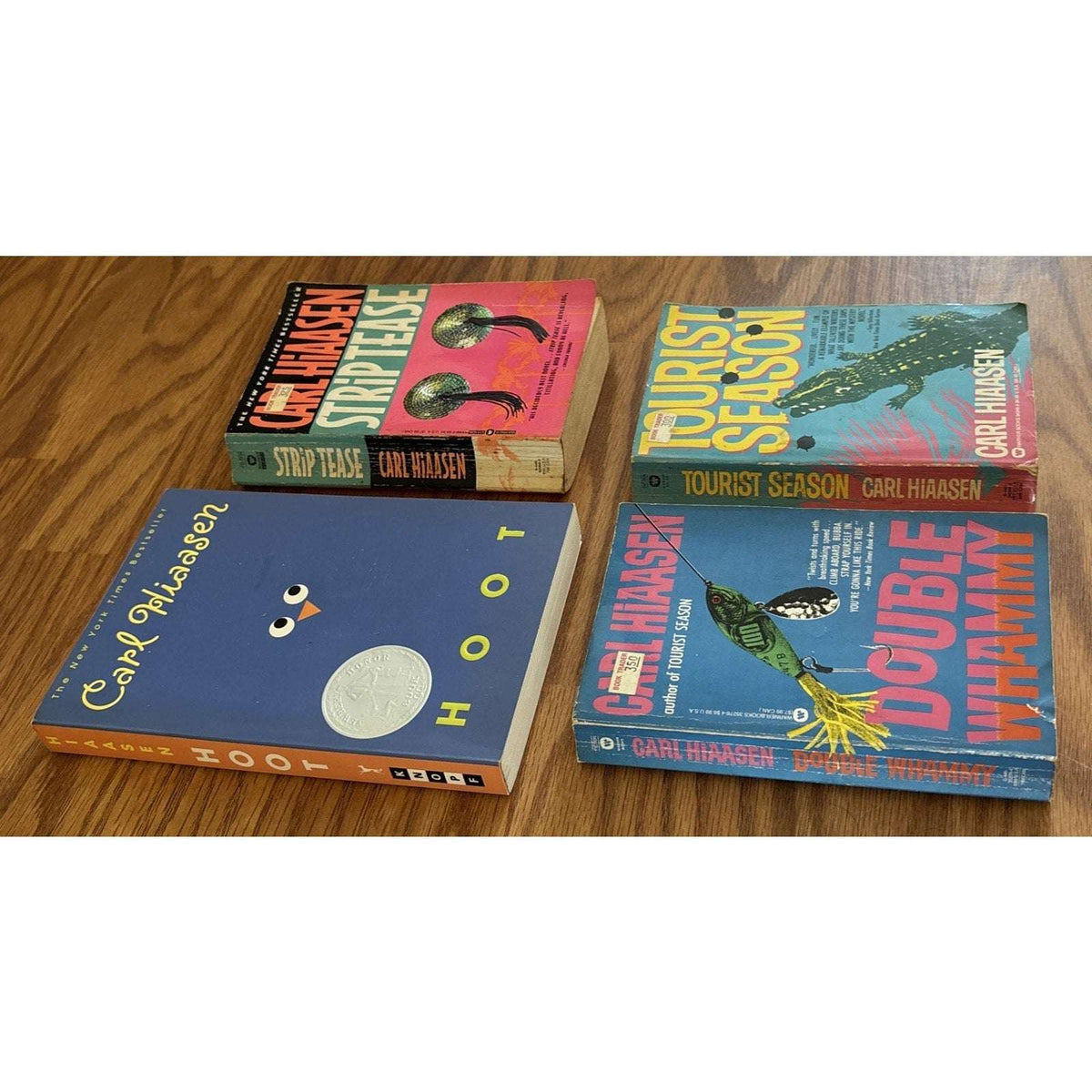 Set of 4 Paperbacks by Carl Hiaasen - Tourist Season, Hoot, Strip Tease, Double Whammy